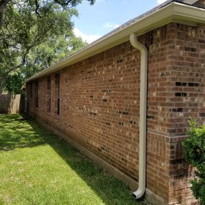 San Antonio Texas gutter installer, installing gutters on a home with a slab foundation